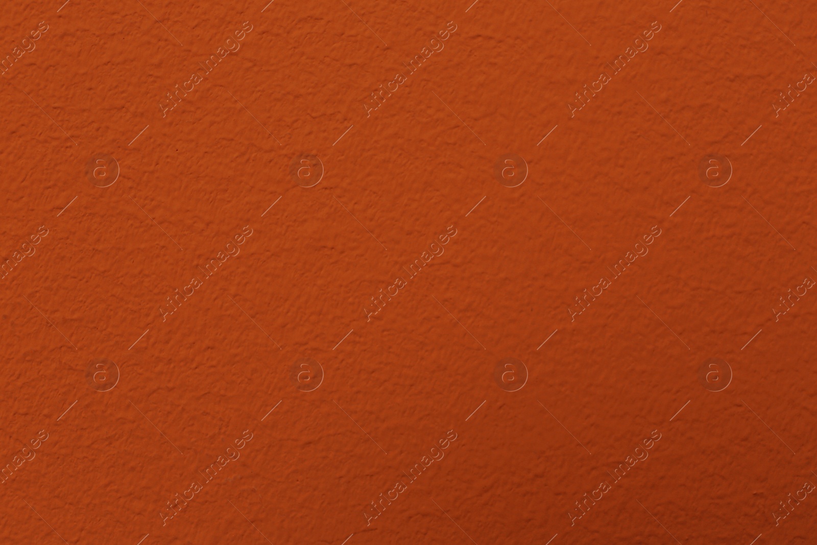 Photo of Orange textured surface as background, closeup view