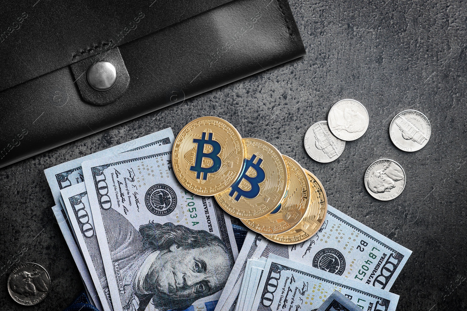 Image of Bitcoins, dollar banknotes, coins and wallet on black background, flat lay