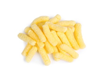 Pile of tasty corn puffs on white background, top view