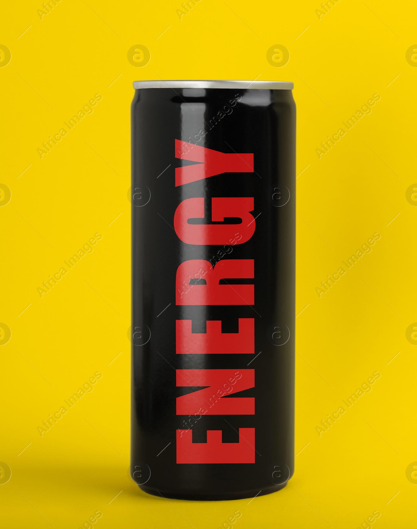 Image of Can of energy drink on yellow background