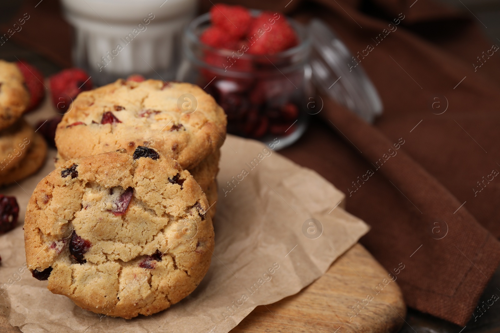Cookies with freeze dried fruits on wooden board, closeup. Space for text Photo of Cookies with freeze dried fruits on wooden board, closeup. Space for text