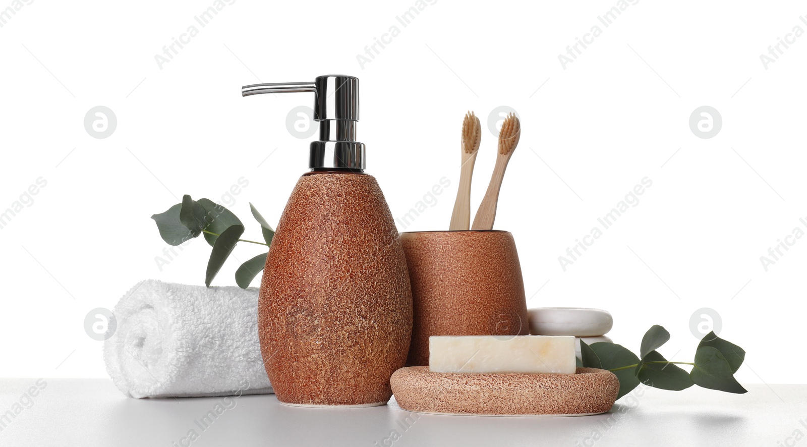 Photo of Bath accessories. Different personal care products and eucalyptus branches on table against white background