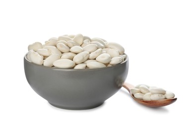 Photo of Spoon and bowl with uncooked navy beans on white background
