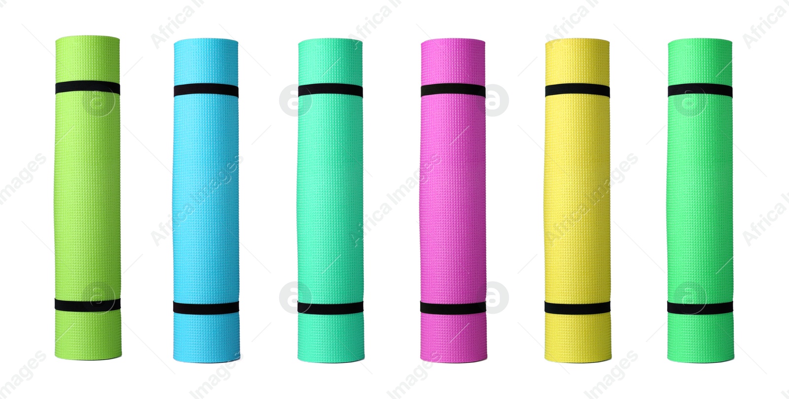 Image of Set with different bright rolled camping mats on white background. Banner design  