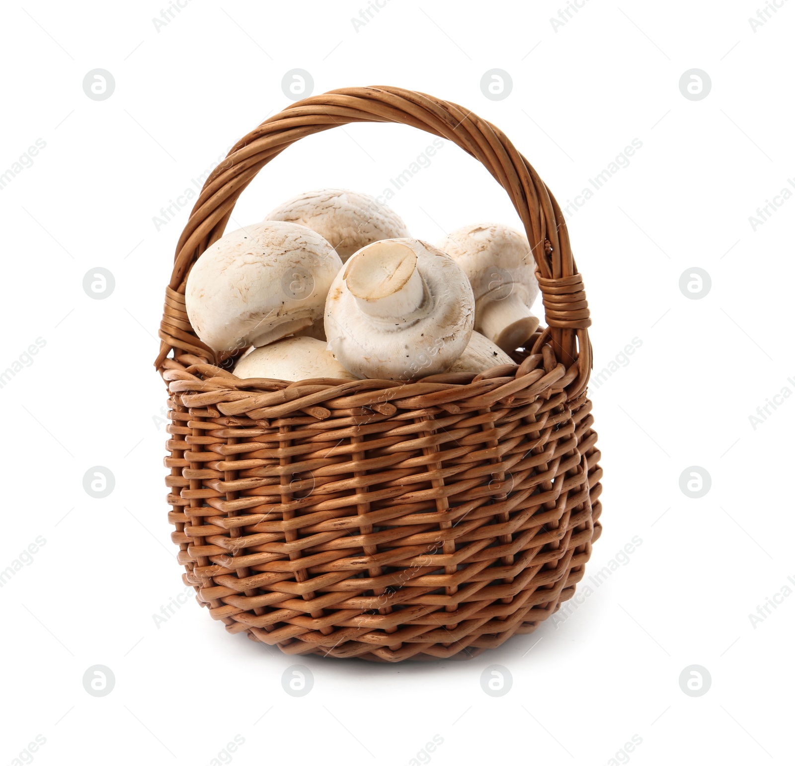 Photo of Wicker basket with fresh raw champignon mushrooms on white background