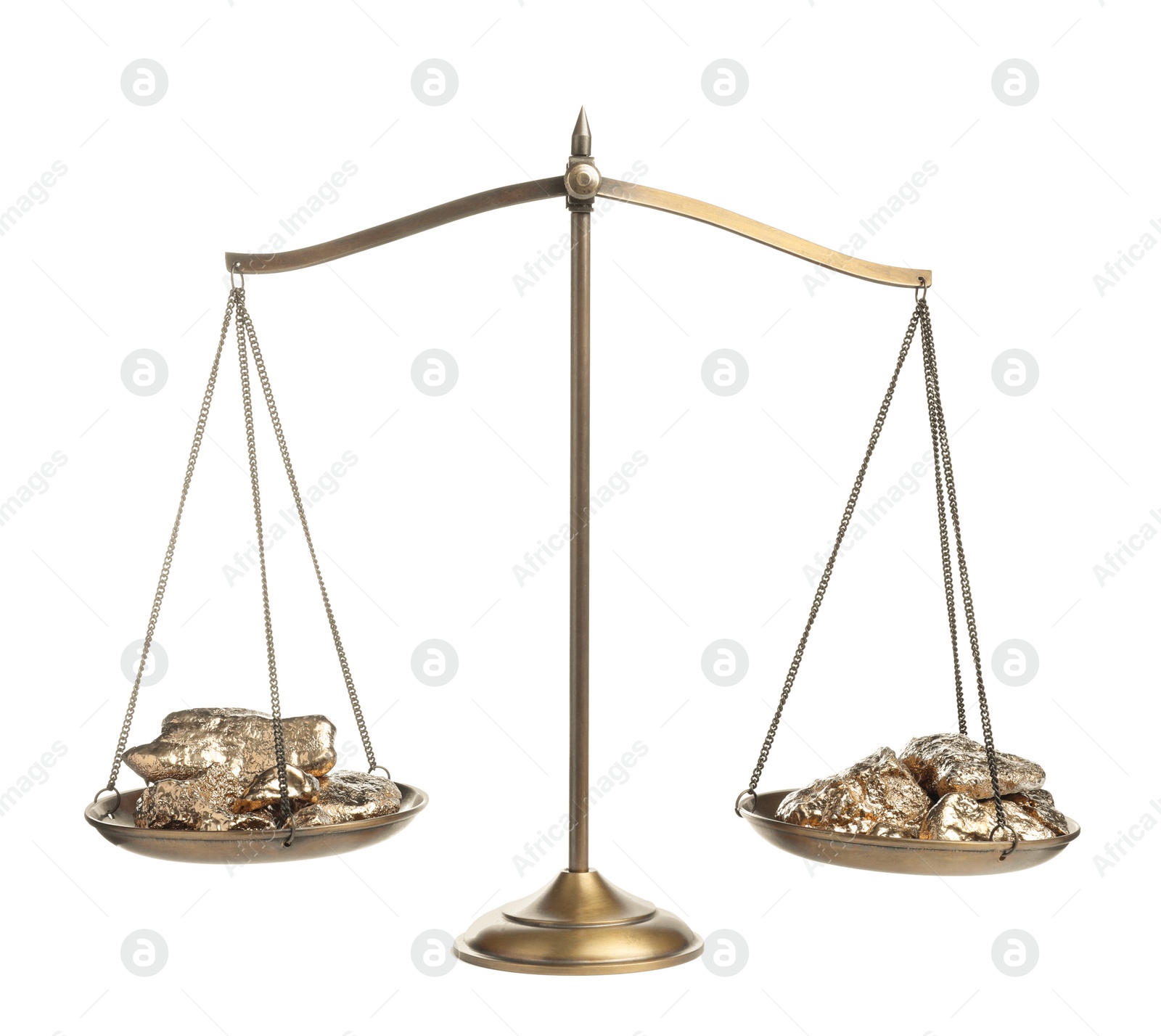 Photo of Scales with gold nuggets on white background