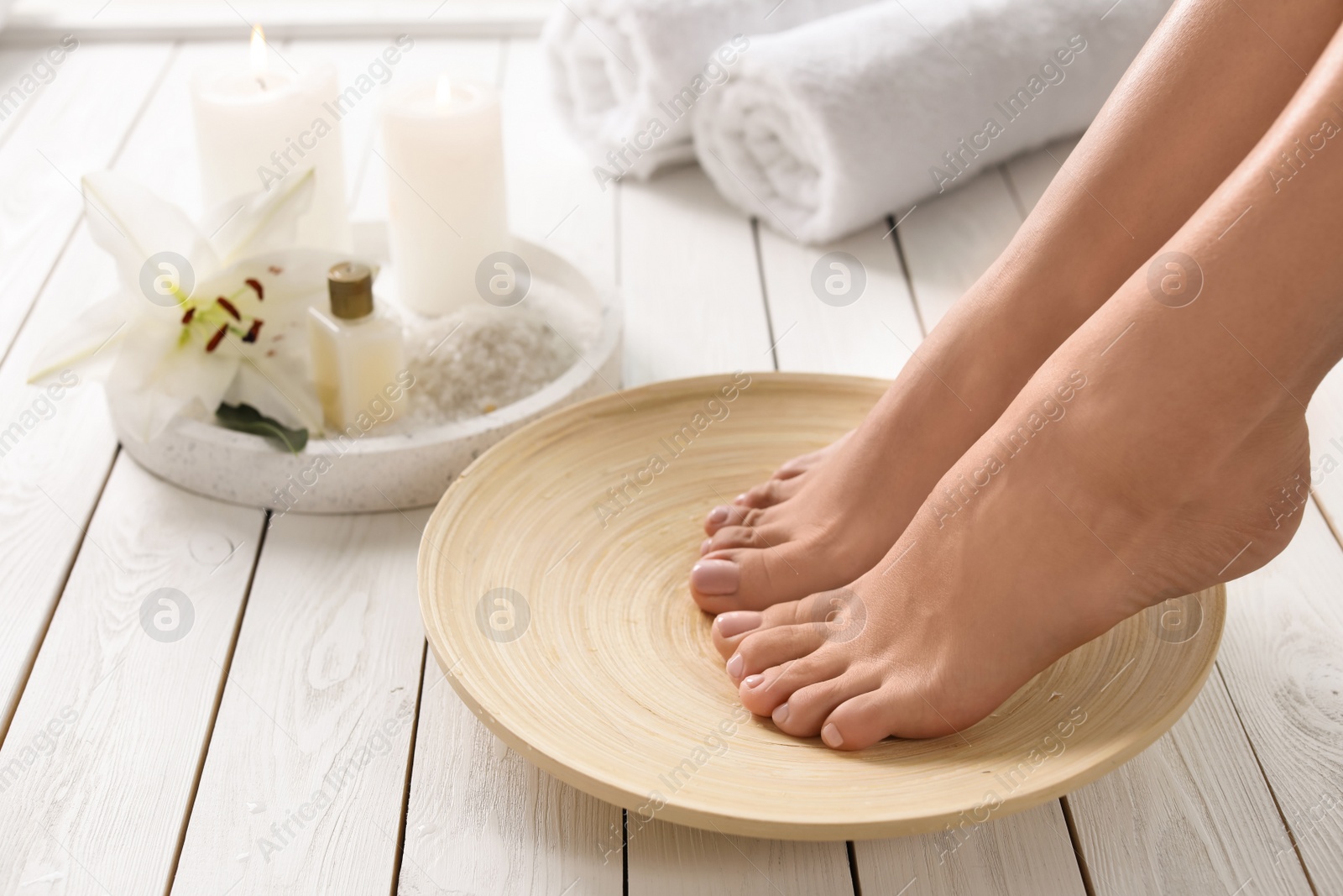 Photo of Closeup view of woman with beautiful feet ready for spa procedure indoors, space for text