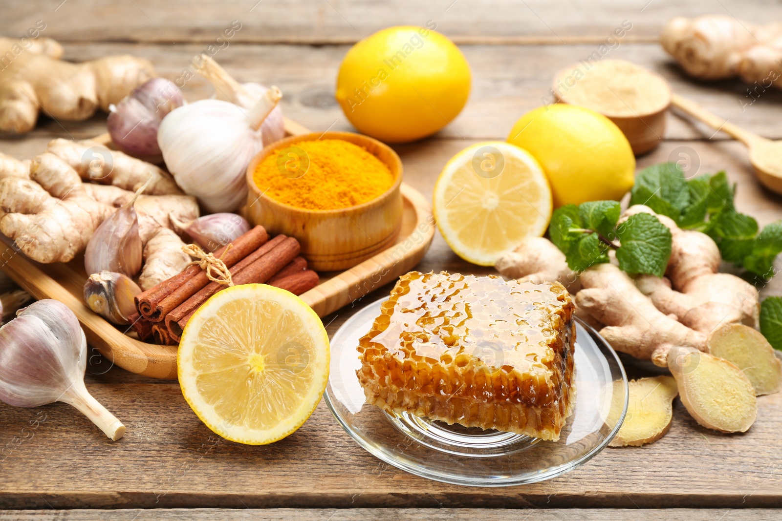 Photo of Different fresh products on wooden table. Natural antibiotics