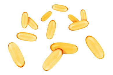 Image of Vitamin. Softgel capsules falling on white background