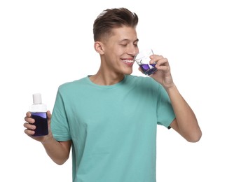 Photo of Young man with mouthwash on white background