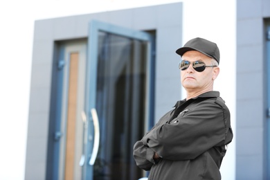 Portrait of male security guard in uniform outdoors