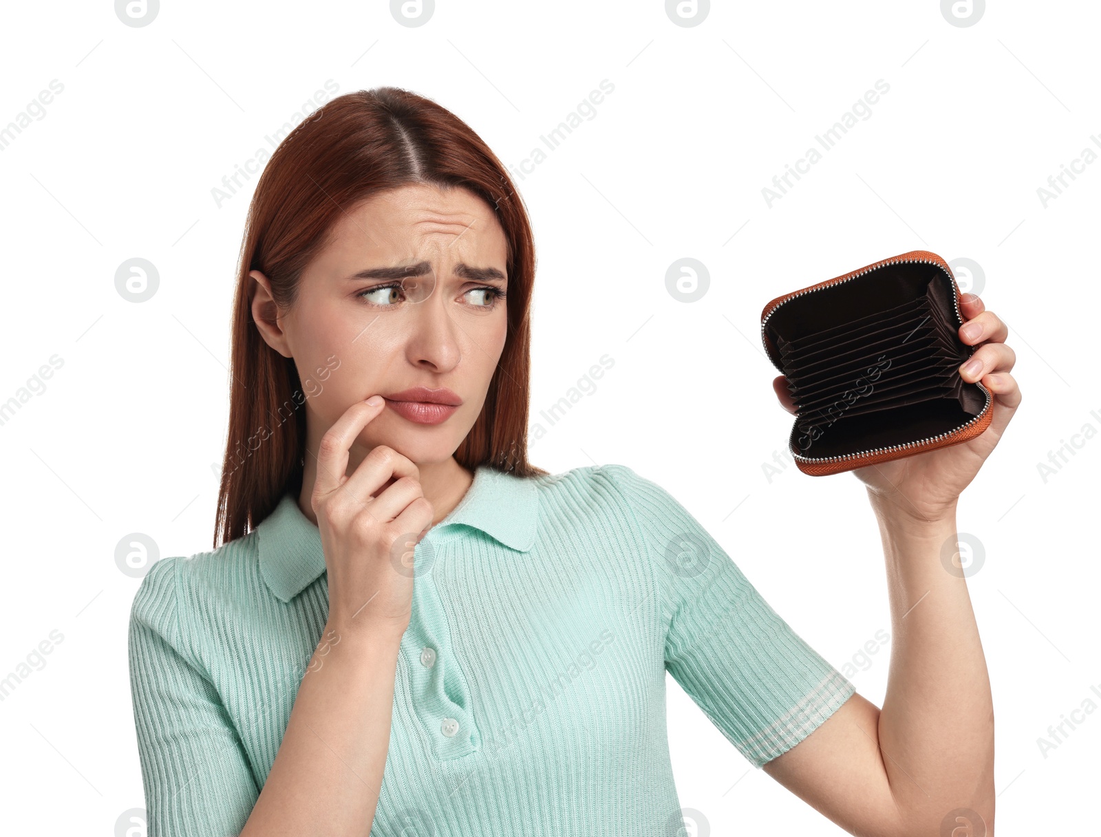 Photo of Upset woman with empty wallet on white background