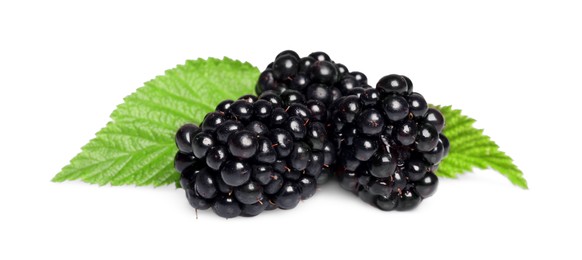 Photo of Tasty ripe blackberries and green leaves isolated on white