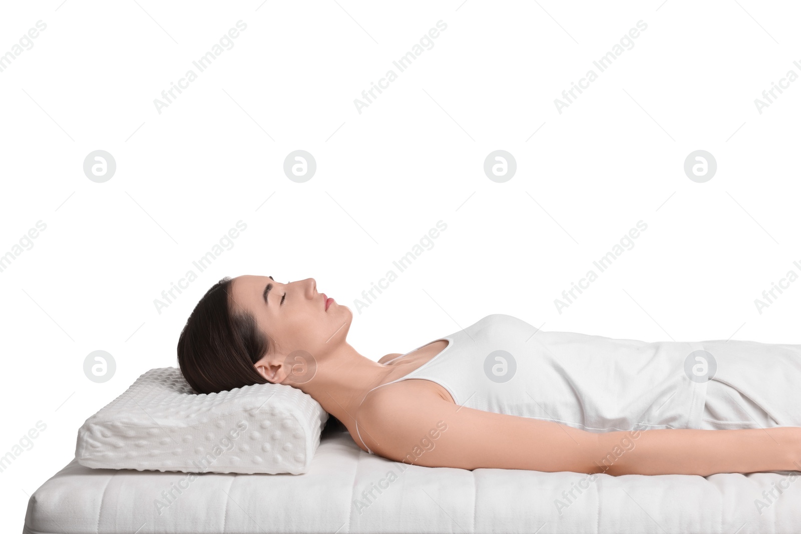 Photo of Woman sleeping on orthopedic pillow against white background