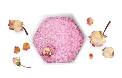 Bowl of pink sea salt and dry rose flowers isolated on white, top view