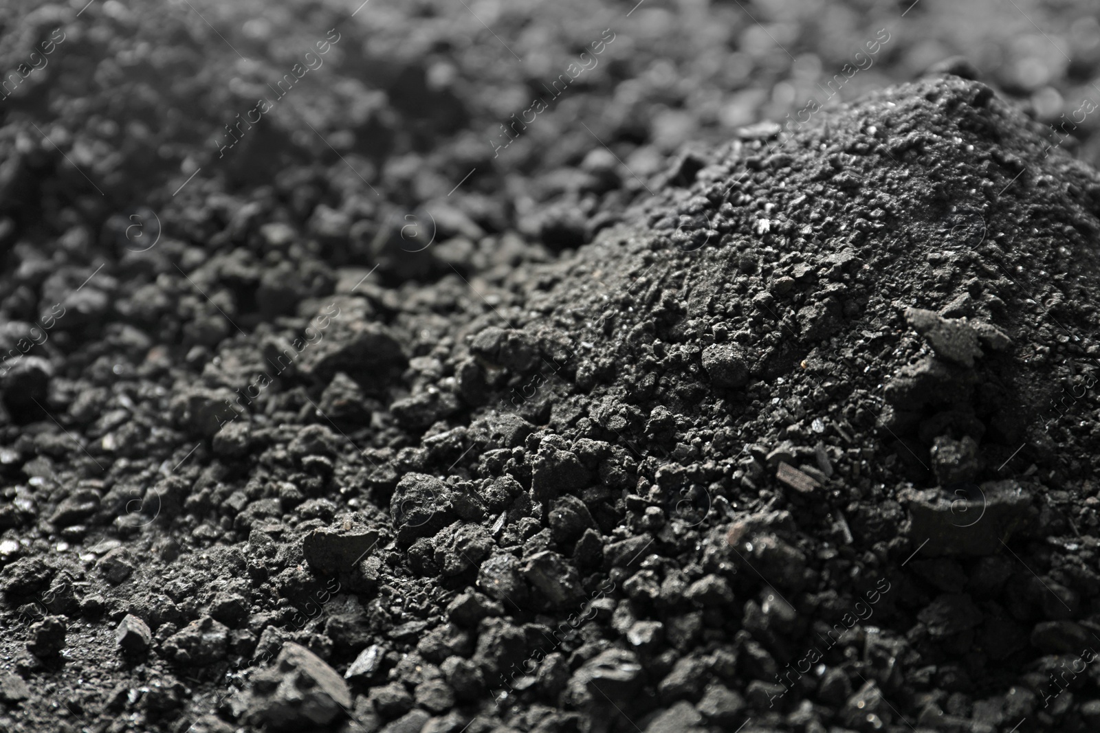 Photo of Black coal as background, closeup. Mineral deposits