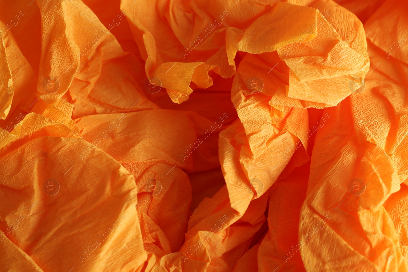 Photo of Orange textured material as background, closeup view