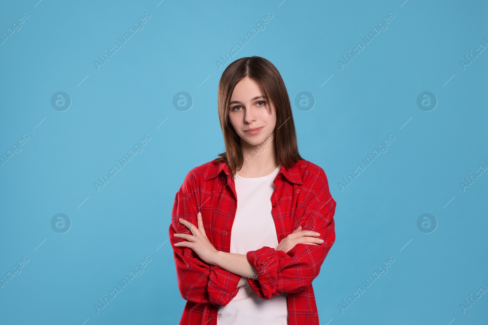 Photo of Portrait of teenage girl on light blue background