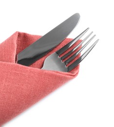 Photo of Fork and knife wrapped in coral napkin on white background, top view