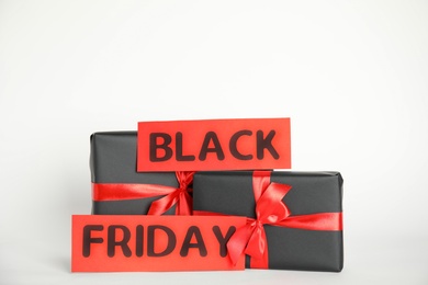 Gift boxes and words Black Friday on white background