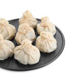 Serving board with tasty fresh khinkali (dumplings) isolated on white. Georgian cuisine