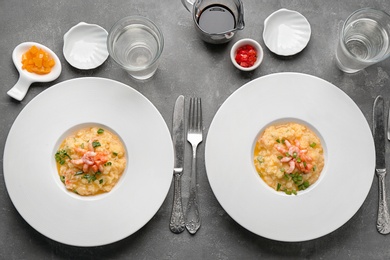 Photo of Plates with tasty shrimps and grits on table, top view