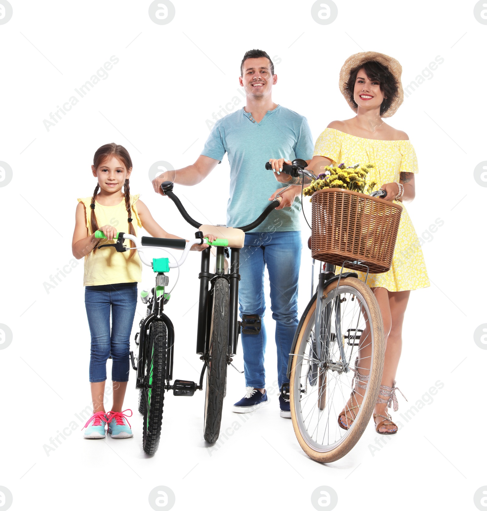 Photo of Portrait of parents and their daughter with bicycles on white background