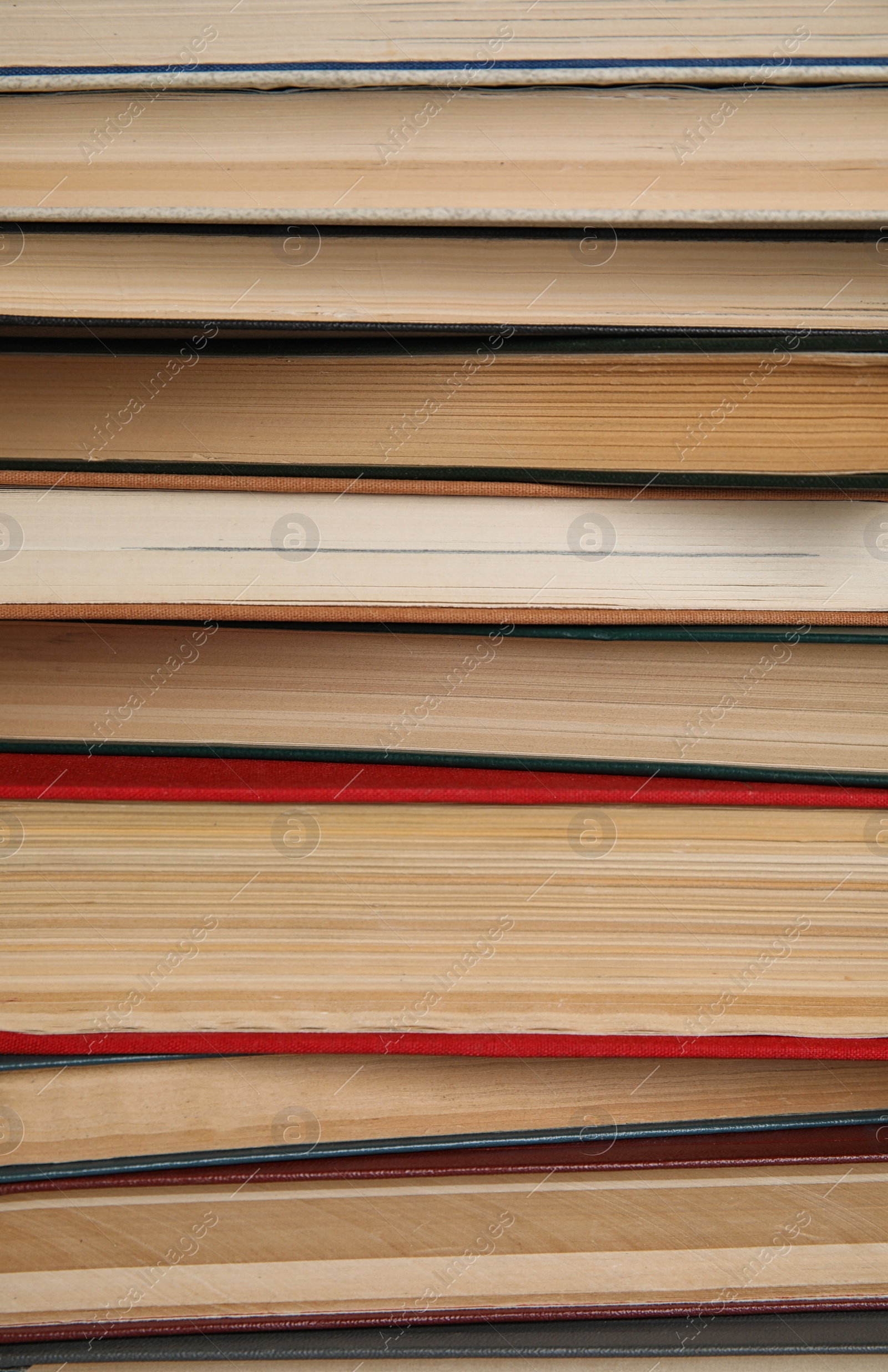 Photo of Stack of hardcover books as background, closeup