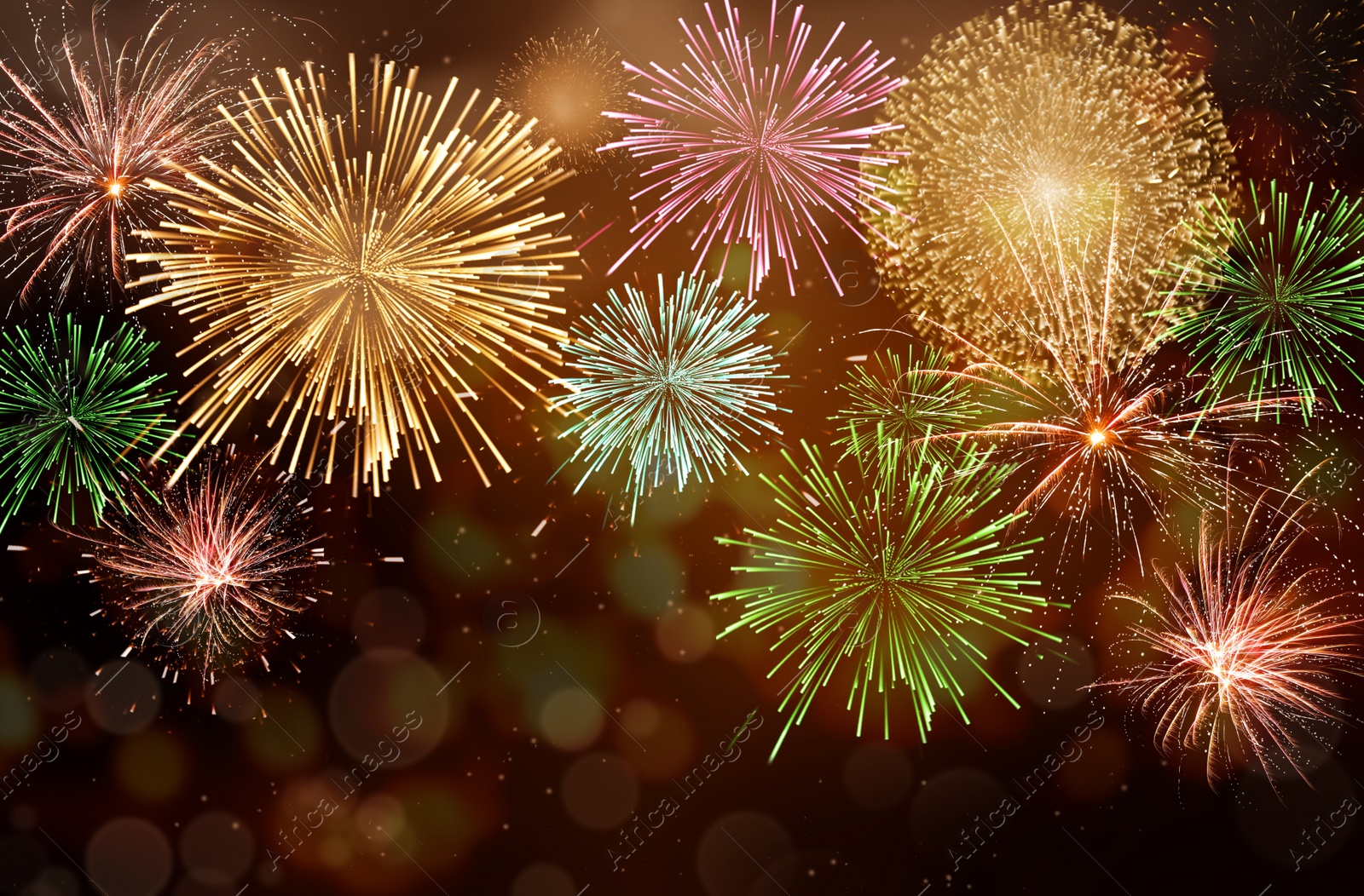 Image of Beautiful bright fireworks lighting up night sky. Bokeh effect