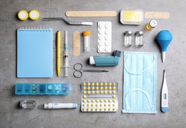 Photo of Flat lay composition with medical items on gray background