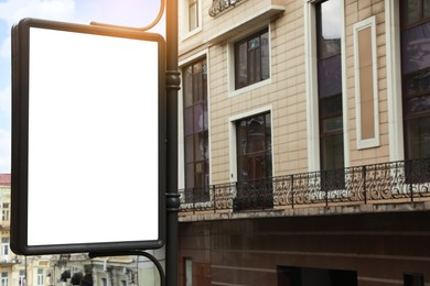 Photo of Blank citylight poster on city street. Advertising board design