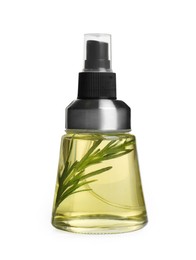 Photo of Spray bottle of cooking oil with rosemary on white background