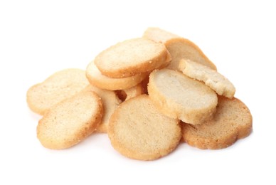 Photo of Pile of delicious crispy rusks on white background