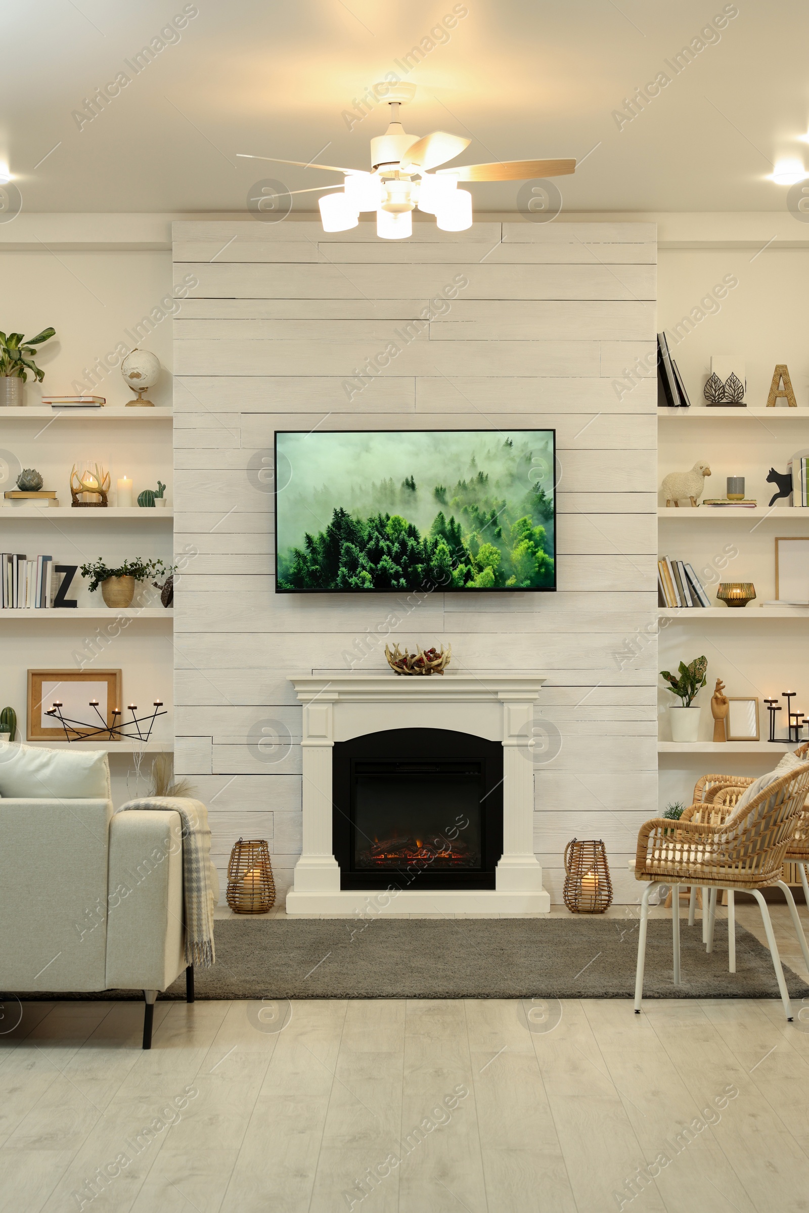 Photo of Cozy living room interior with decorative fireplace