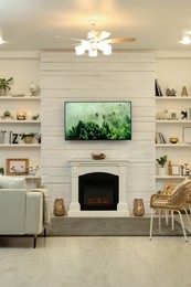 Photo of Cozy living room interior with decorative fireplace