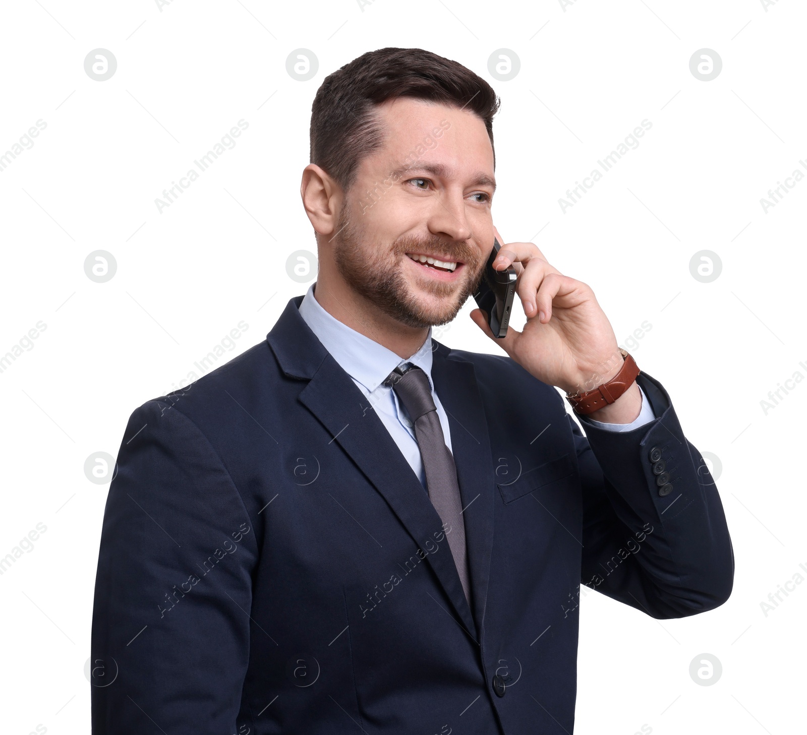 Photo of Handsome bearded businessman in suit talking on smartphone against white background