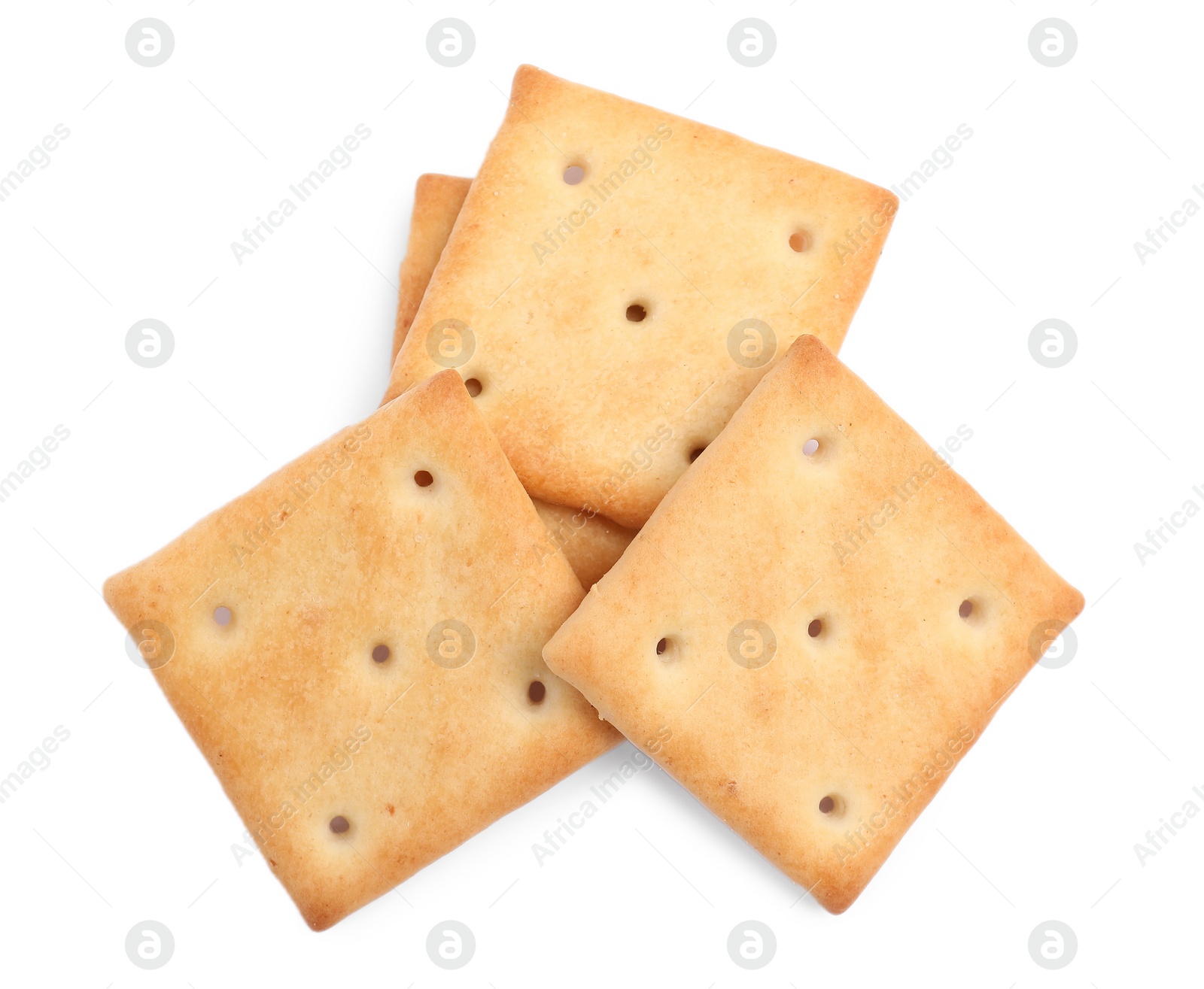 Photo of Tasty crispy square crackers isolated on white, top view