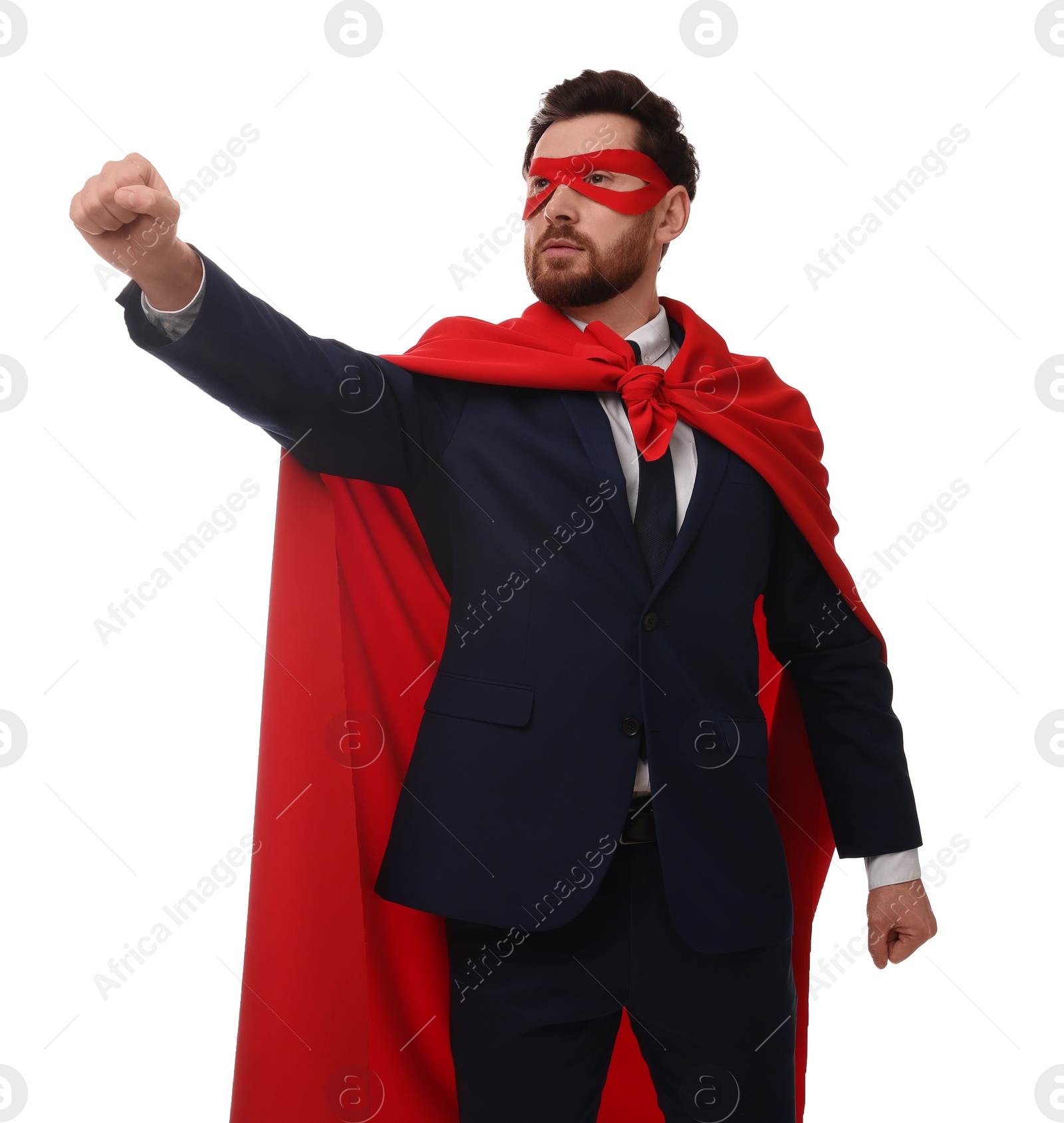 Photo of Confident businessman wearing red superhero cape and mask on white background