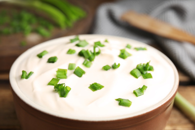 Photo of Fresh sour cream with onion in bowl, closeup