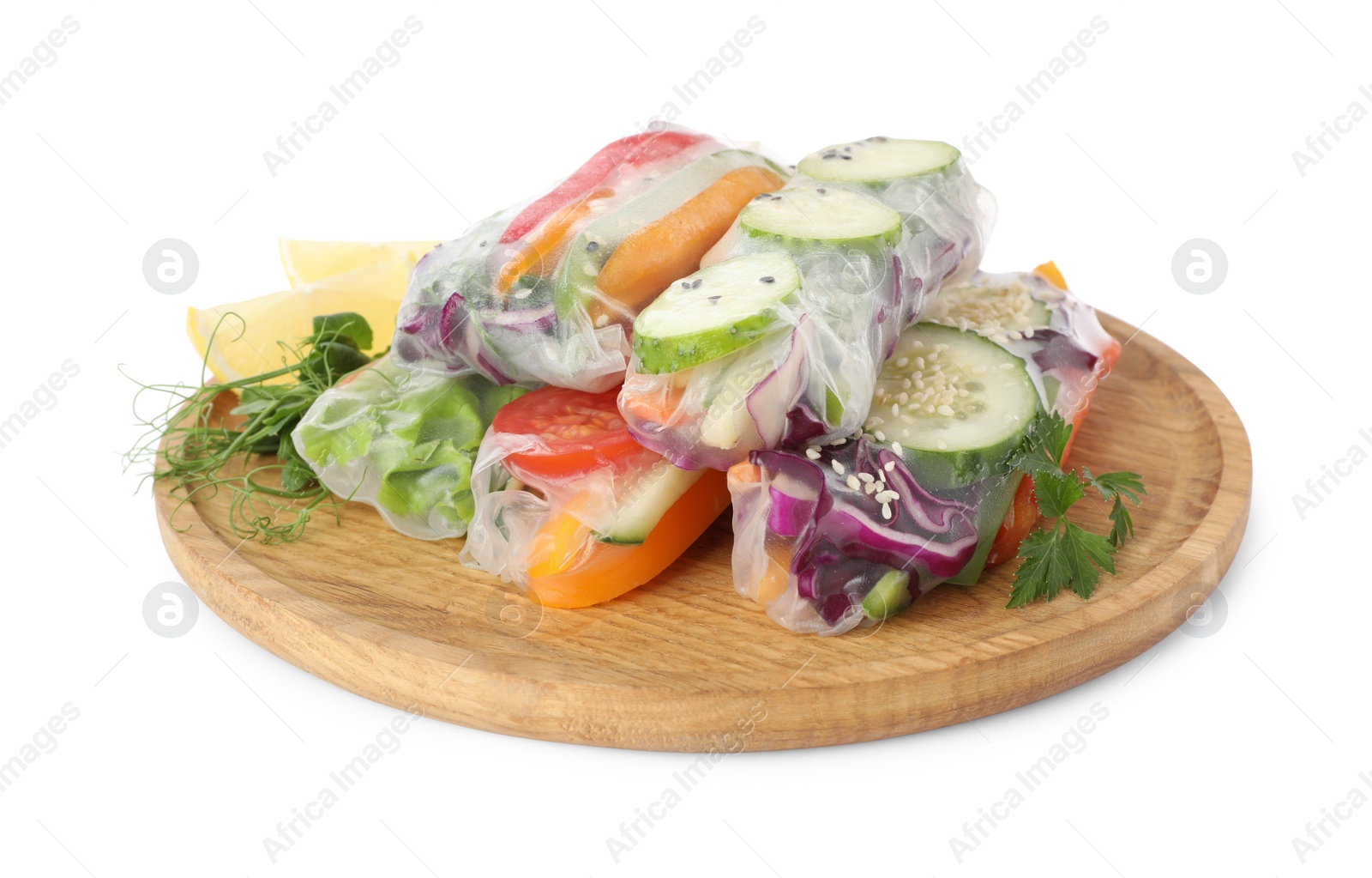 Photo of Many different delicious rolls wrapped in rice paper isolated on white