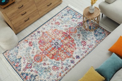 Photo of Stylish living room with beautiful carpet and furniture, above view. Interior design