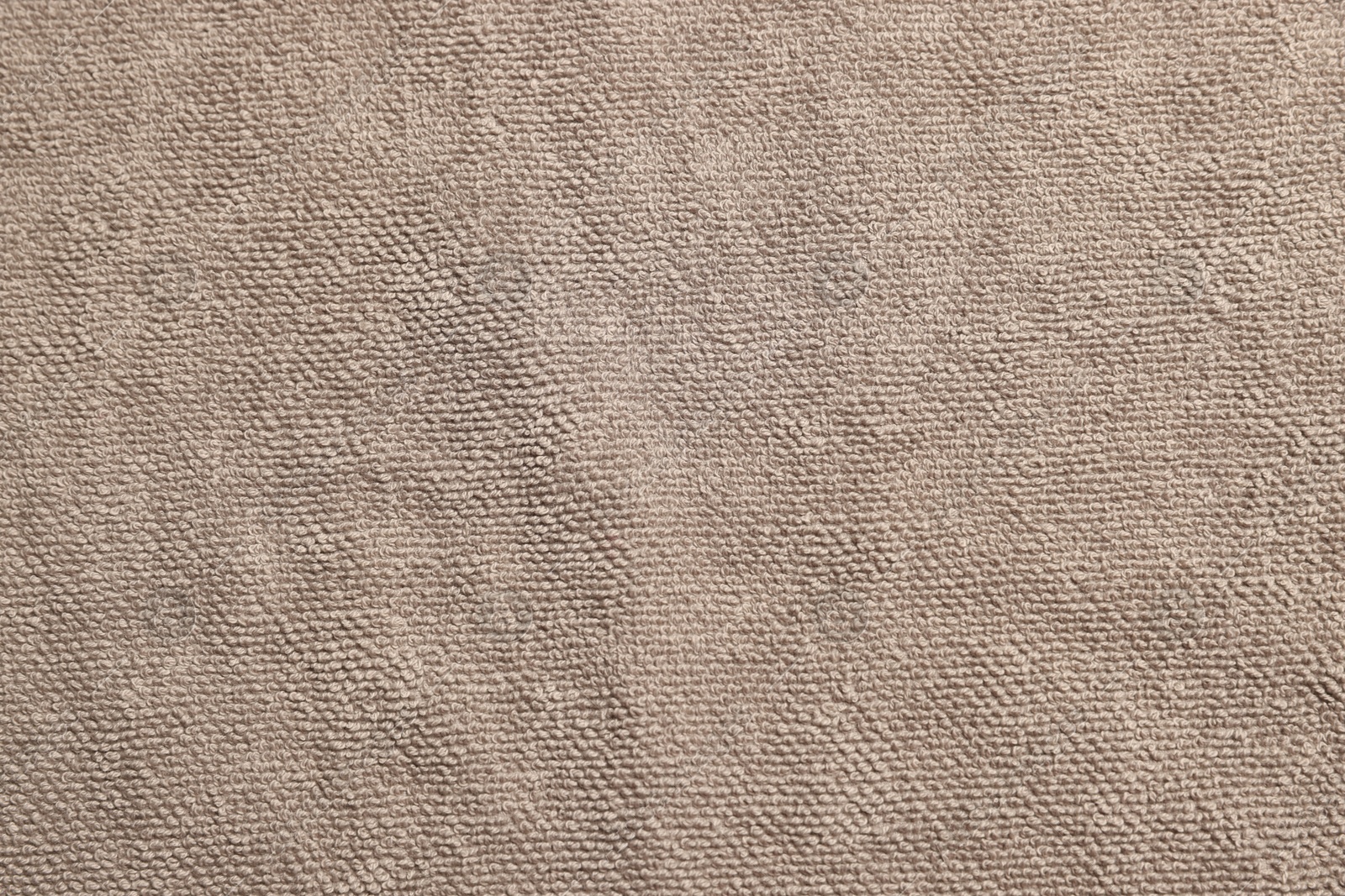 Photo of Soft brown towel as background, top view