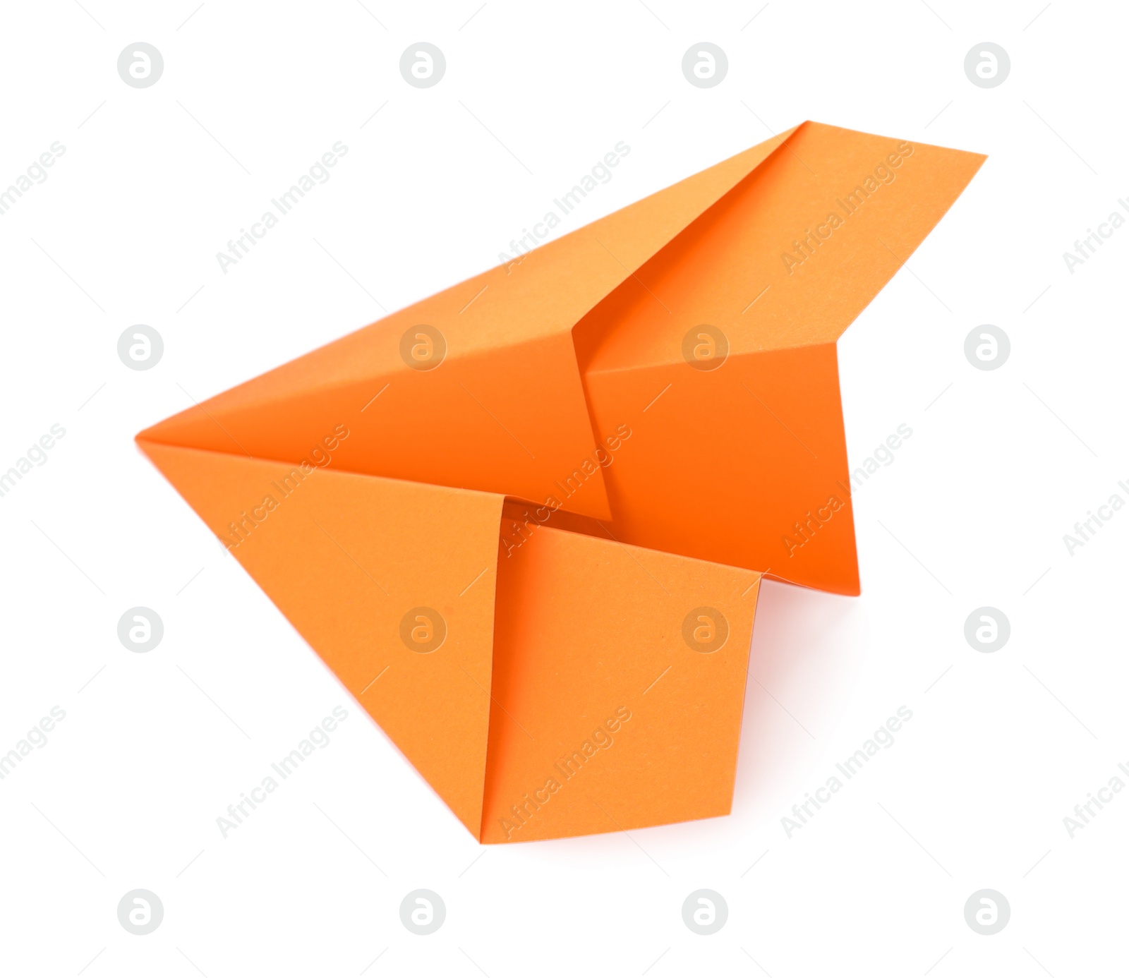 Photo of Handmade orange paper plane isolated on white