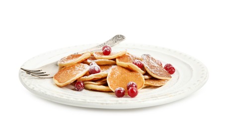 Photo of Delicious mini pancakes cereal with cranberries on white background