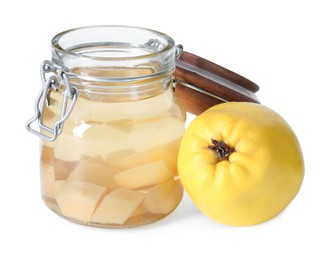 Delicious quince drink in glass jar and fresh fruit isolated on white