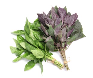 Photo of Green and purple basil on white background, top view. Aromatic herbs