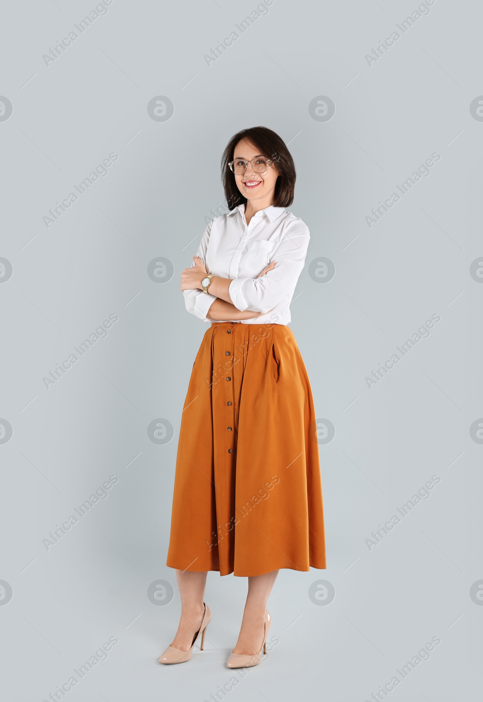 Photo of Full length portrait of mature businesswoman on light grey background