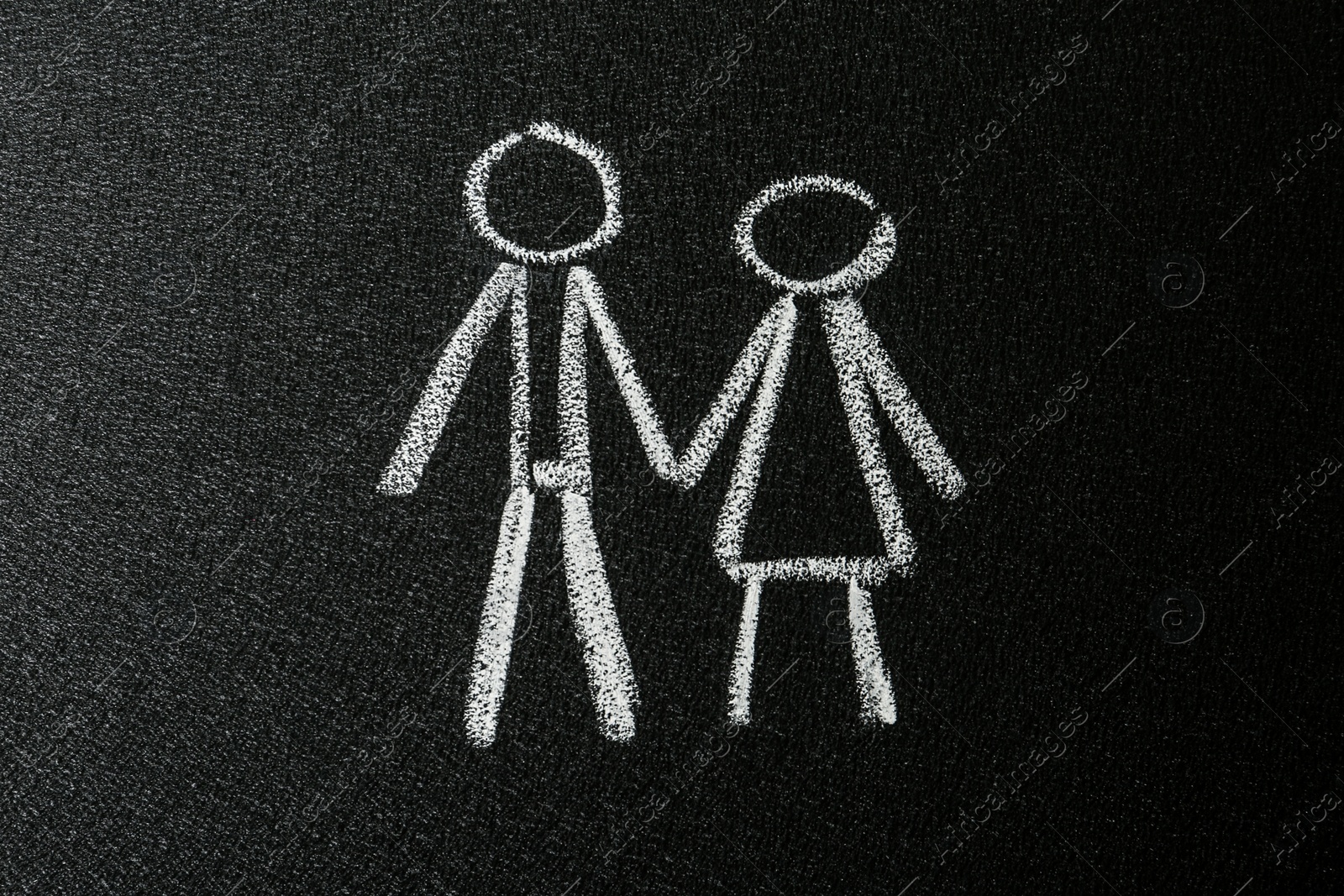 Photo of Figures of man and woman drawn on blackboard. Sex education