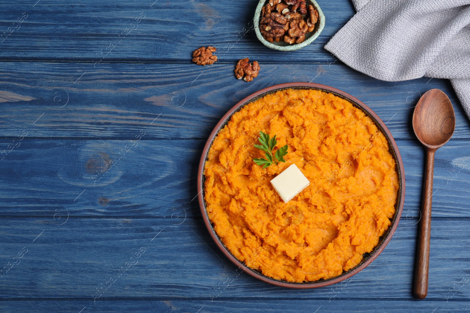 Photo of Flat lay composition with mashed sweet potatoes on wooden background, space for text