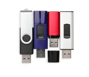 Photo of Modern usb flash drives on white background, top view